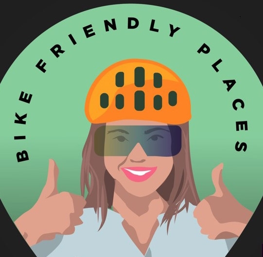 En tjej med cykelhjälm som gör tummen upp. Text Biker friendly places. Illustration.